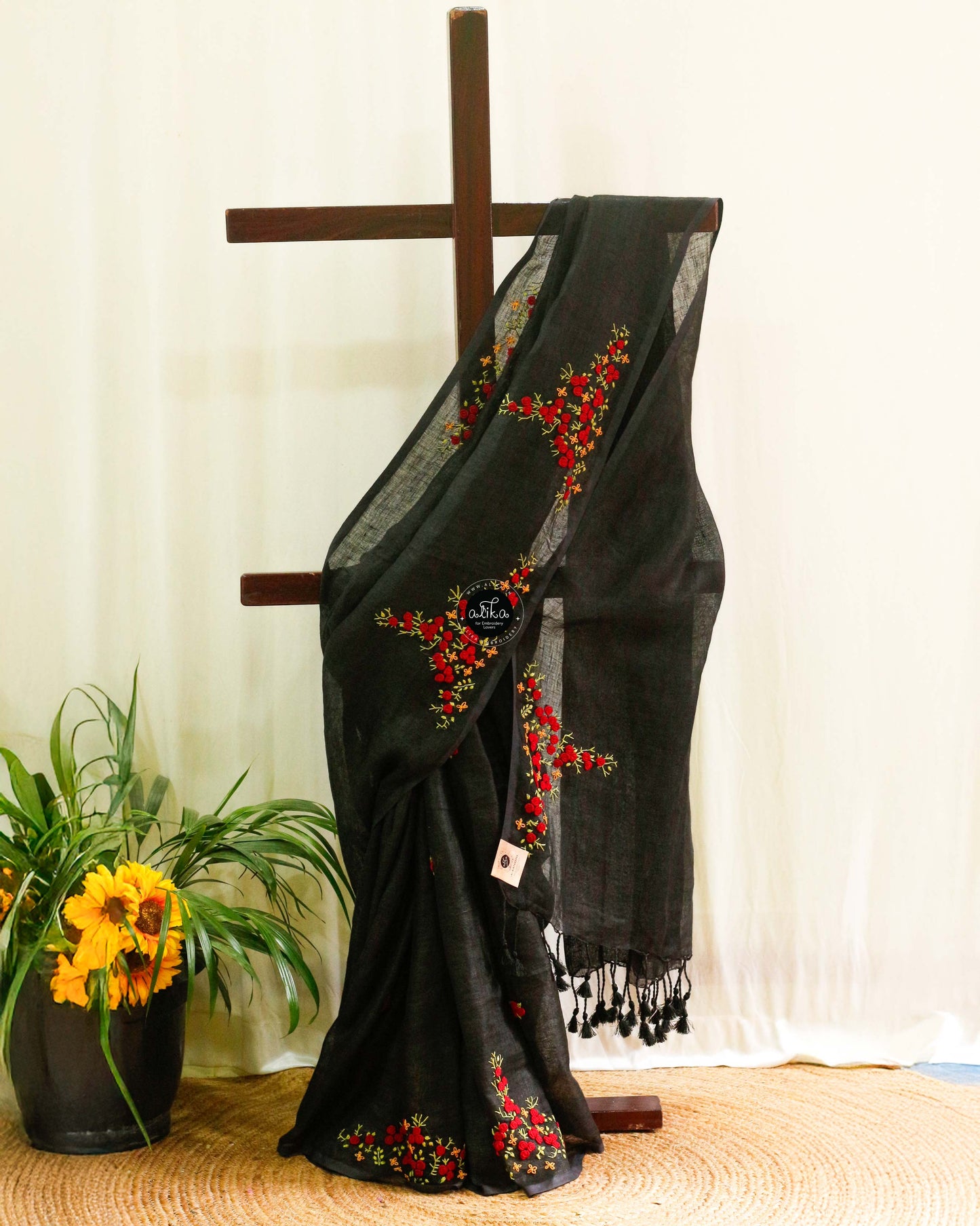 Elegant Black Linen Saree with Striking Red Embroidery