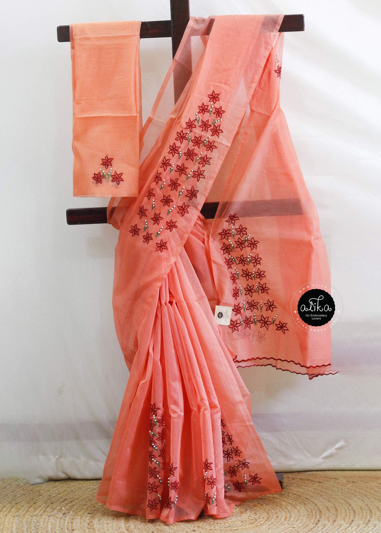 Sunset Orange Kota Saree with Red Floral Cutwork & Pearls – Handcrafted Elegance by Alika Fashion Store