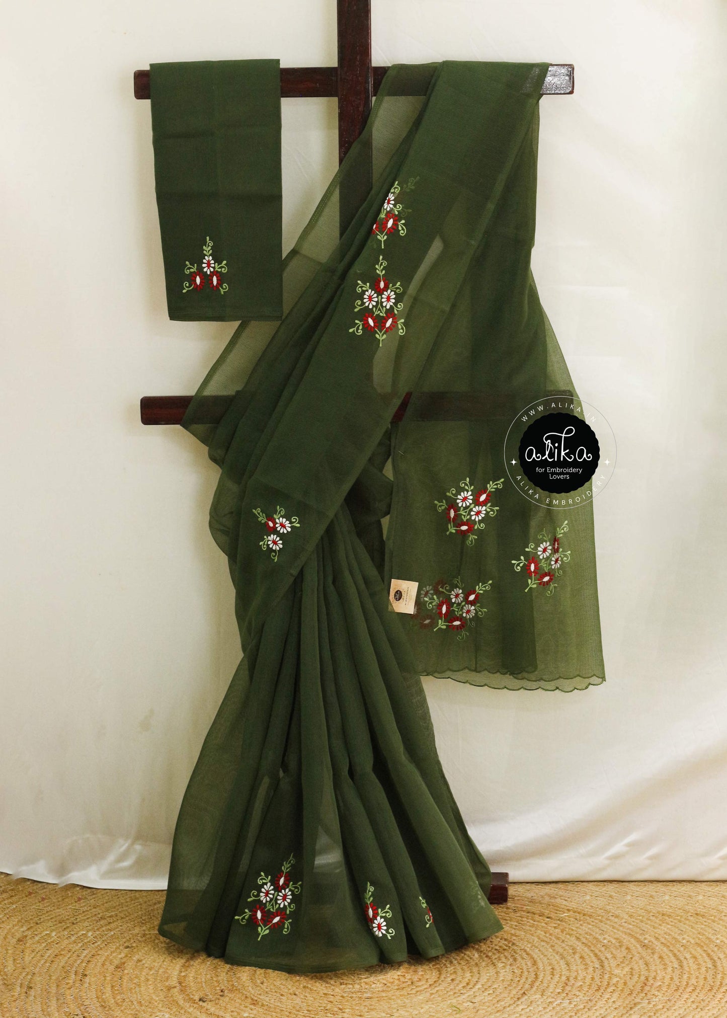 Product Title: Dark Pine Green Kota Saree with Red & White Floral Hand Embroidery by Alika Fashion Store