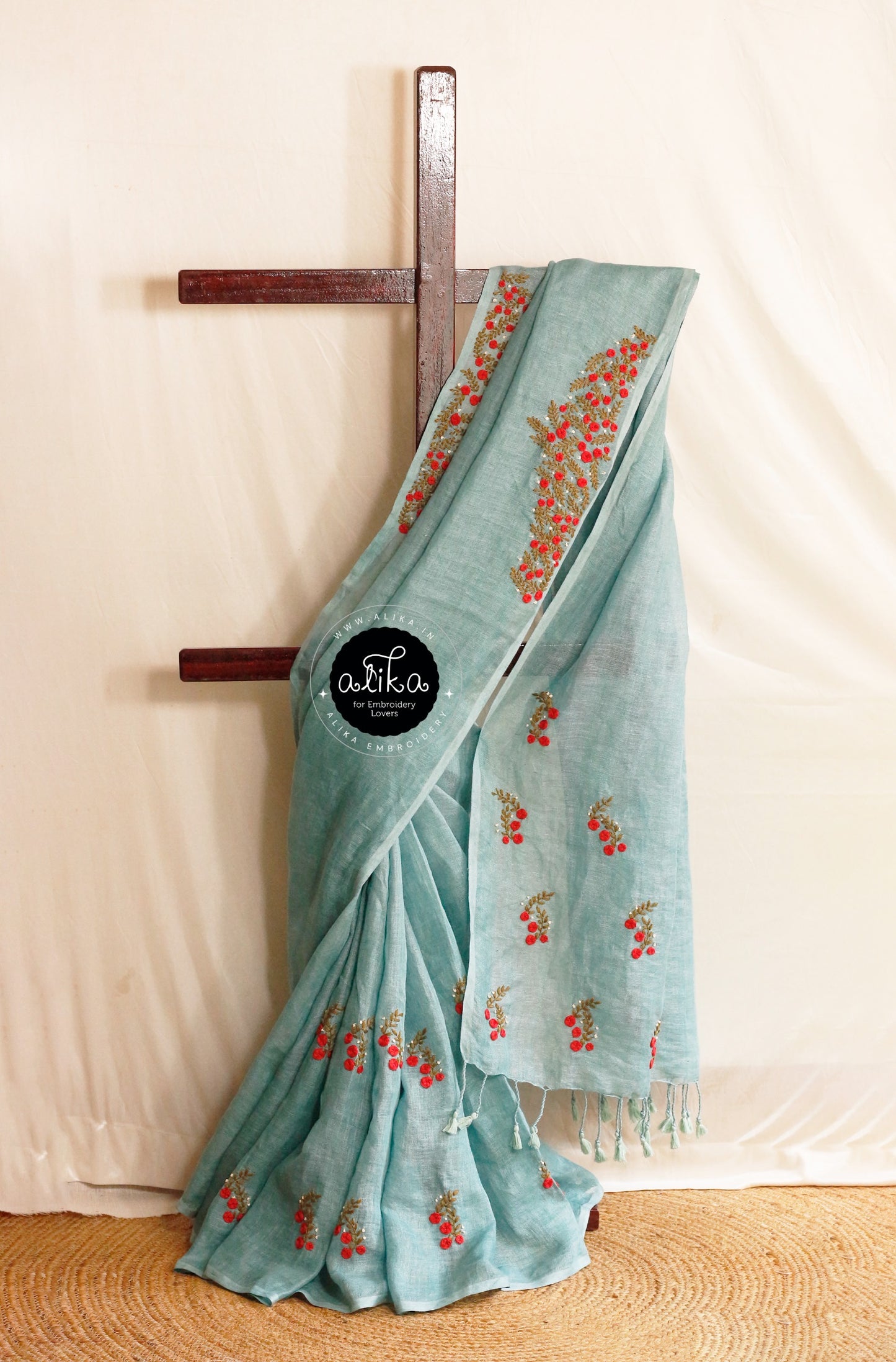 Mohair Soft Blue Linen Saree with Red Floral Embroidery – Elegant & Lightweight | Alika Fashion Store .