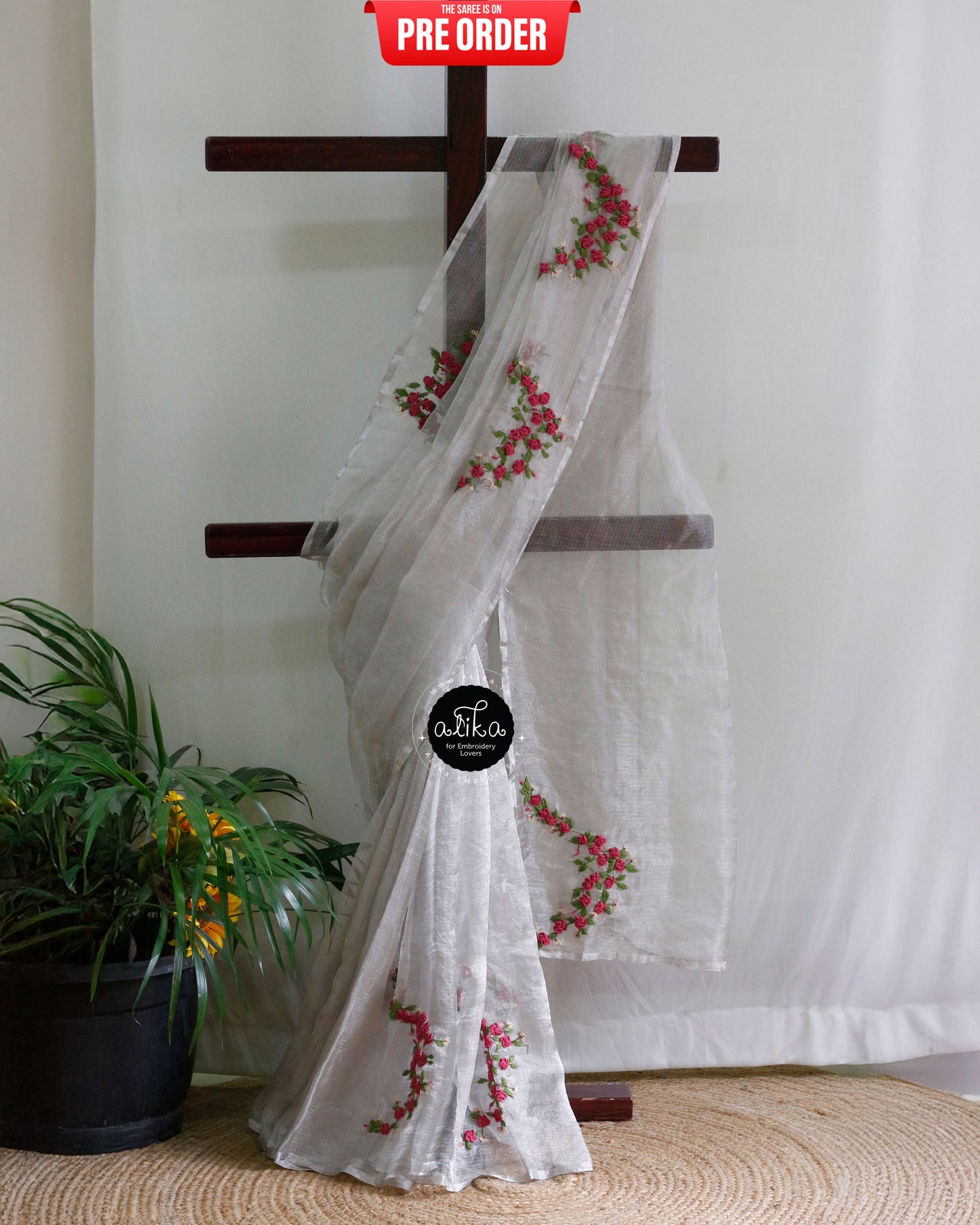 Shimmering Silver Tissue Silk Saree: A Masterpiece of Hand Embroidery